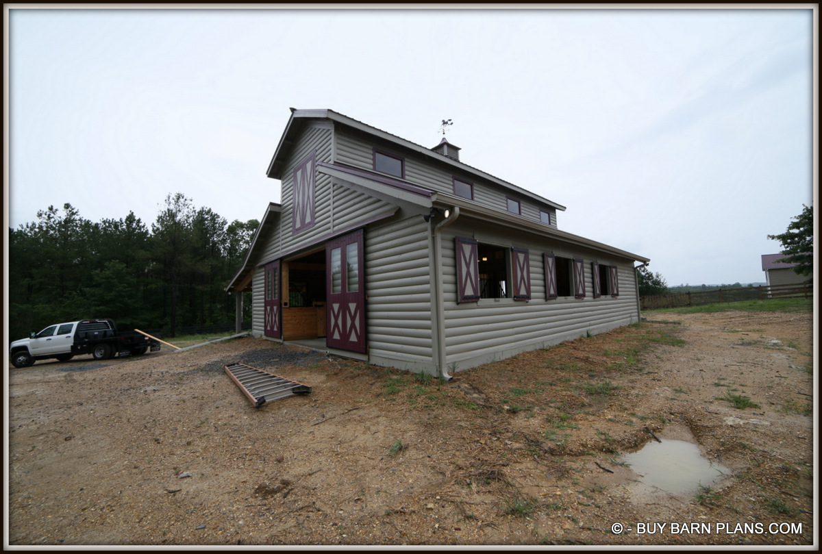 Photo Image Of A 5 Stall Stall Monitor Horse Barn with D log Yellow Pine Siding With 2 Coats Of Solid Stain - Not Paint - Custom Cupola