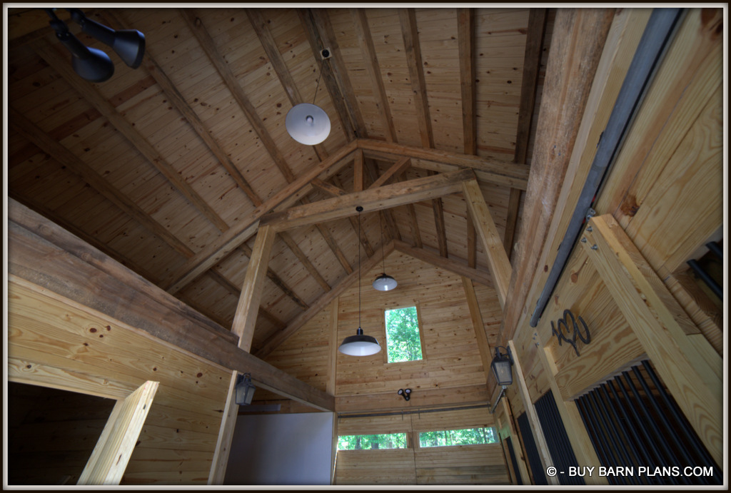 Photo T&G Ceiling Finish Over 6 x 6 Purlins Over - 12 inch King Truss - Flood Lights Shinning On The Ceiling For Indirect Lighting - Buy Barn Plans.com