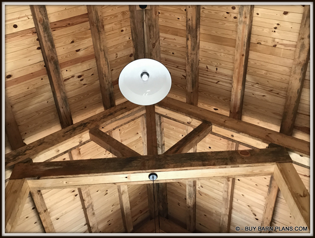 T&G Ceiling Finish Over 6 x 6 Purlins Over - 12 inch King Truss - Flood Lights Shinning On The Ceiling For Indirect Lighting - Buy Barn Plans.com