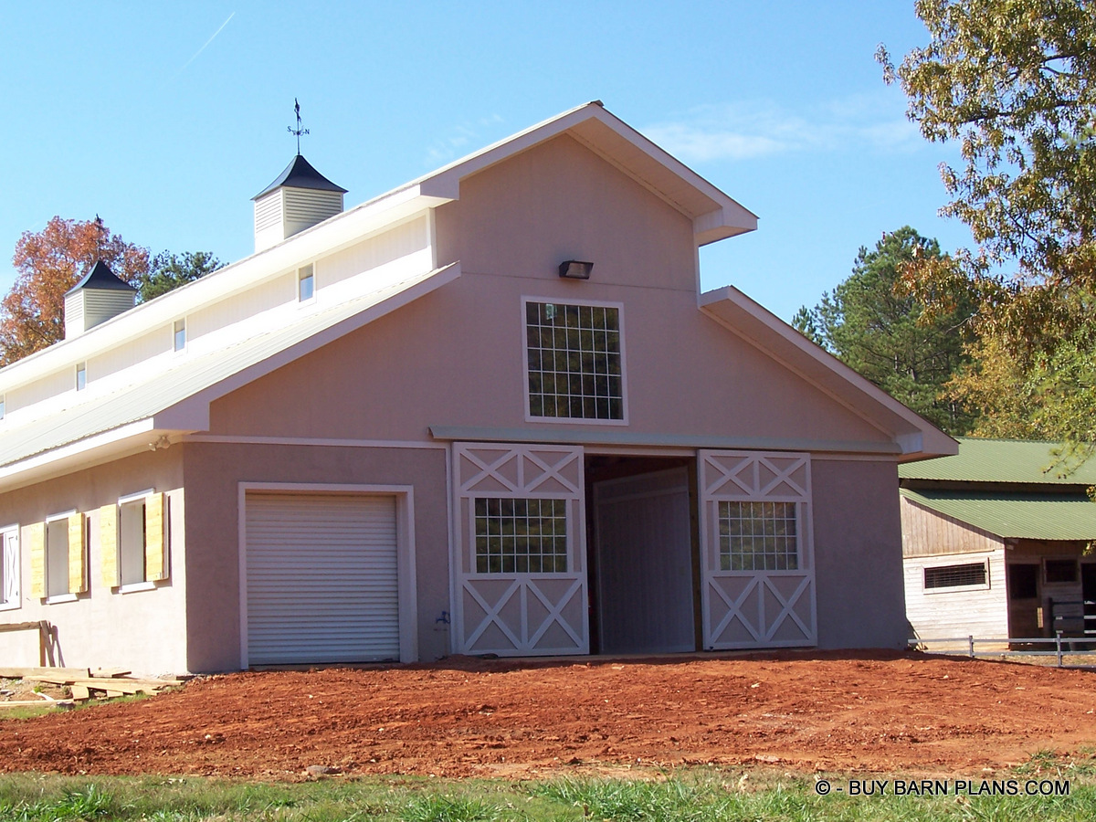 Final Grade Photo Image View Of -Twelve Stalls -Twelve Stall Monitor Style Horse Barn Built With Concrete Blocks Up To 12 Feet Sidewalls Walls and Stucco Finish