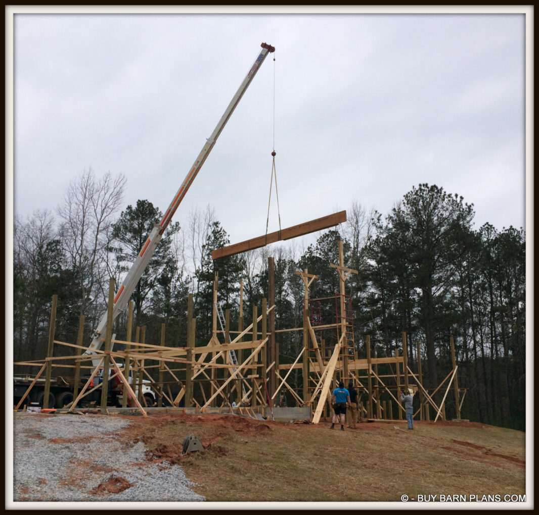 Framing 2 Ply 24 Inch LVL Ridge Being Set With A Crane White Oak Barn Home Buy Barn Plans .com Framing - 2 Ply 24 Inch LVL Ridge Being Set With A Crane - Perfect Balance