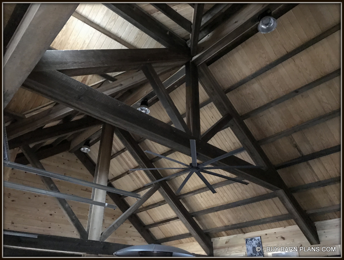 Interior Photo Image View Of 1 x 6 T&G Roof Decking Over 4 x 6 Stained Purlins Over Massive King Trusses- This Gearhead Garage That Looks Like A Rustic Old Barn On The Exterior
