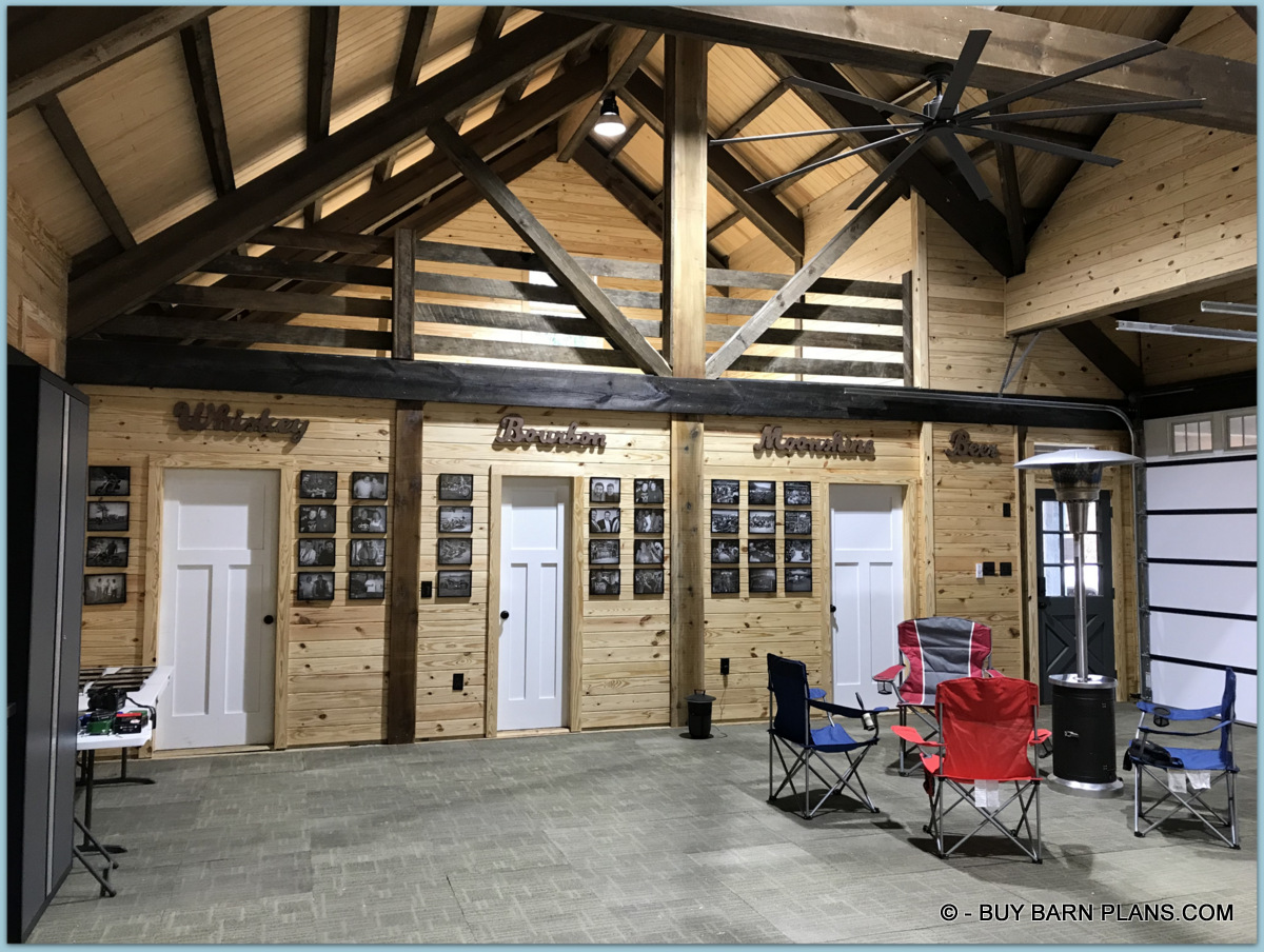 Interior Photo View Of Three Doors - Kitchen - Bath - Office - This Gearhead Garage With Carpet Matt Flooring That Looks Like A Rustic Barn + A Heater That Keeps Everybody Full Of Warth