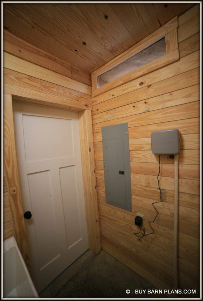 Interior Photo View Of Utility Closet -Utility Sink - Braeker Panel - This Gearhead Garage That Looks Like A Rustic Barn