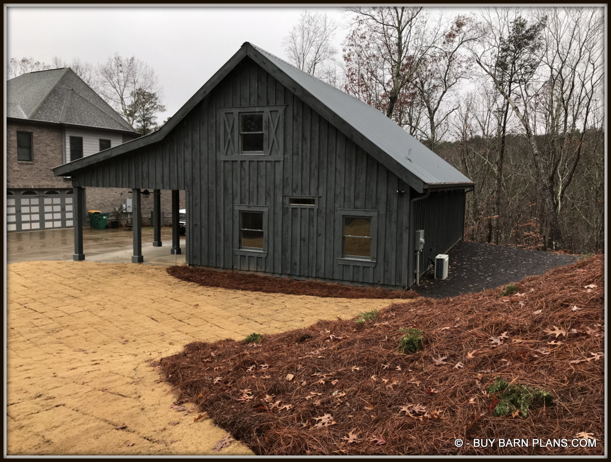Photo - Board & Batten Siding With two Coats Of Solid Stain - Metal Roof - Freeze Proof Water Hydrant Gear head 2 Car Garage That Looks Like A Barn