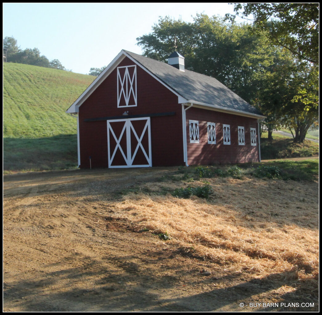 Photo Of A Bright Red With White Trim - Working Saloon Style Windows - Tractor Storage Barn With Loft - Hardie Lap Siding - Buy Barn Plans