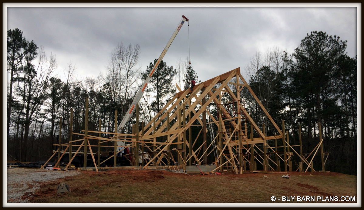 Photo Image Of Framing 2 Ply 24 Inch LVL Ridge Being Set With A Crane White Oak Barn Home Buy Barn Plans .com Photo Image Of Framing - 2 Ply 24 Inch LVL Ridge Being Set With A Crane