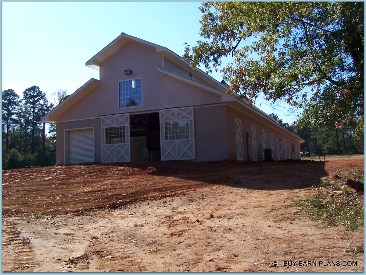 Photo Image View Of -Twelve Stalls -Twelve Stall Monitor Style Horse Barn Built With Concrete Blocks Up To 12 Feet Sidewalls Walls and Stucco Finish