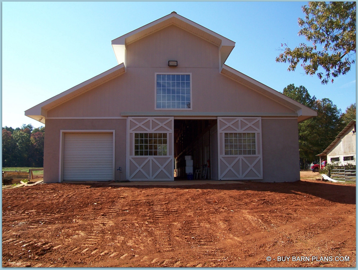 Photo Image View Of -Twelve Stalls -Twelve Stall Monitor Style Horse Barn Built With Concrete Blocks Up To 12 Feet Sidewalls Walls and Stucco Finish
