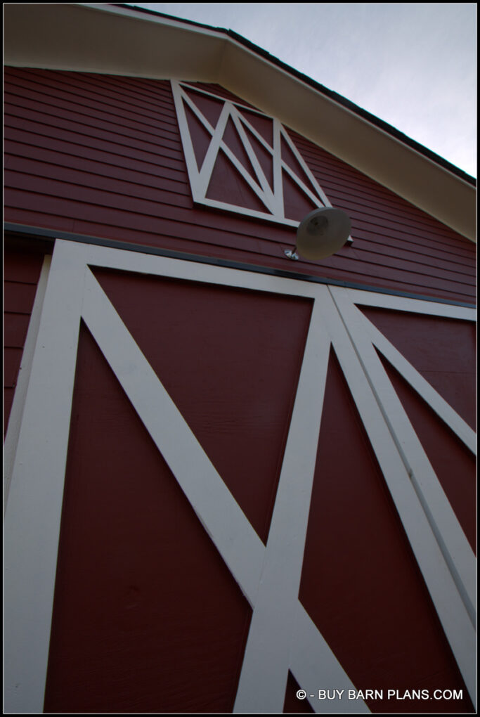 Photo Of A Bright Red With White Trim - Faux Loft Door On The Front Side - - Tractor Storage Barn With Loft - Buy Barn Plans