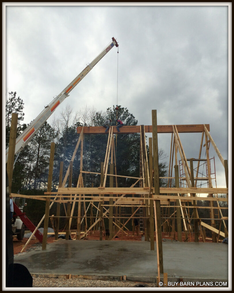 Photo Of Framing 2 Ply 24 Inch LVL Ridge Being Set With A Crane White Oak Barn Home Buy Barn Plans .com Photo Of Framing - 2 Ply 24 Inch LVL Ridge Being Set With A Crane